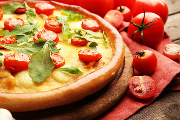 Pizza Margherita with arugula and vegetables, close-up