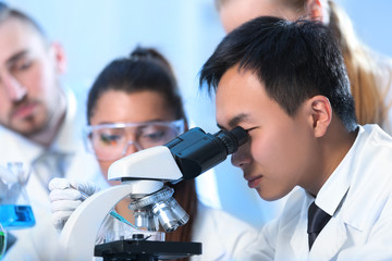 Young medical technicians working in laboratory