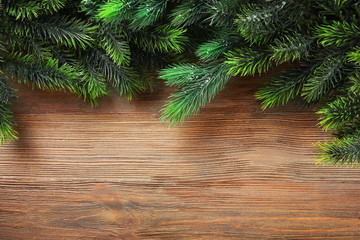 Christmas fir tree branches on wooden table