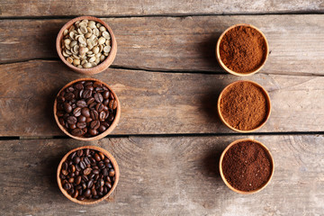 Collection of coffee beans on old wooden table, close up