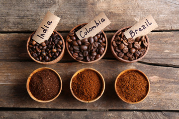Collection of coffee beans on old wooden table, close up