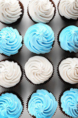 Blue and white delicious cupcakes background