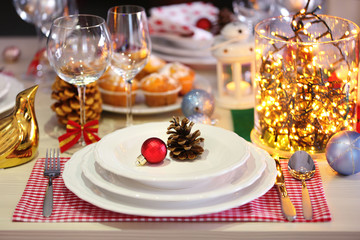 Christmas table setting with holiday decorations