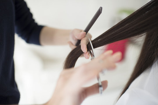 Hairdresser has cut the long hair of women