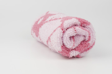 Rolled towel on white background