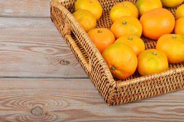 Mandarin on wickered tray