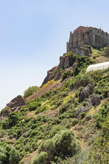 Fototapeta na wymiar Ancient Stavrovouni Monastery (327-329 AD) on mountain against blue sky background. Cyprus. 