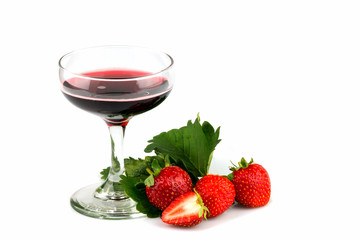 Red wine in a glass with fresh strawberries for celebration