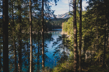 Beautiful vibrant landscape with sundown on mountain lake Eibsee, located in the Bavaria, Germany, near Zugspitze mountain, Alps, Europe.
