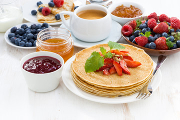 crepes with strawberry, jams and honey 