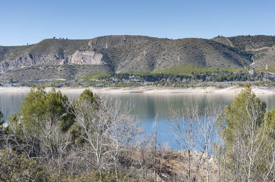Views of Buendia Reservoir, in the upper waters of the river Tagus, Cuenca, Spain. The surface area of the reservoir measures 8,194 hectares, and it can hold a total of 1,638 cubic hectometres.