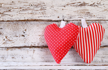 image of colorful fabric heart on wooden table. valentine's day celebration concept
