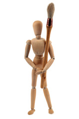 Homme en bois portant un pinceau