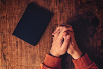 Hands of Christian woman praying
