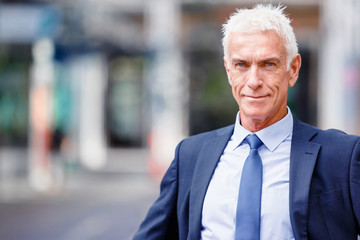 Portrait of confident businessman outdoors