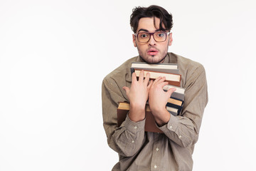 Man in glasses holding many books