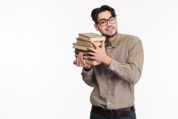 Happy casual man holding books