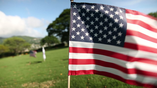 American flag at Military Memorial Cemetery. HD clip of the American flag, Veterans Day, Oahu, Hawaii.