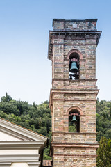 Fototapeta na wymiar Church bell tower of the Shrine of the Bath in Castiglione Fiorentino