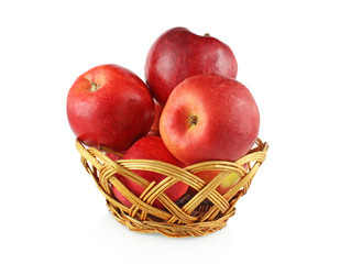 Red apples lie in Wicker Bowl