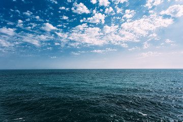 Cold Sea Ocean And Blue Sky Background With Cloudscape