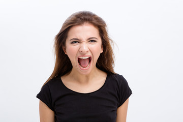 Mad angry young woman shouting with opened mouth
