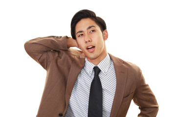 疲れた表情のビジネスマン