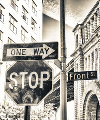 Street signs in front of Manhattan Bridge, New York City