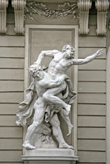 VIENNA, AUSTRIA - APRIL 23, 2010: Sculptures Hercules Wrestling Antaeus near the Hofburg Palace in Vienna, Austria - obrazy, fototapety, plakaty