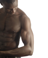 A black man with a muscular body and white background.