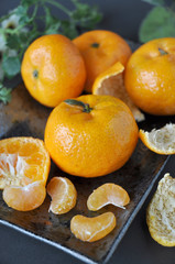 Close up Fresh Oranges on Black Plate
