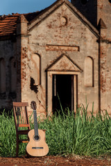 Classical acoustic guitar in ruins of abandoned church at Palmit