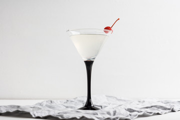 Cocktail in martini glass on the wooden background