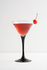 Cocktail in martini glass on thewhite  wooden background