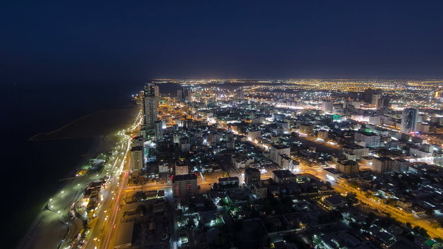 Cityscape of Ajman from rooftop day to night timelapse. Ajman is the capital of the emirate of Ajman in the United Arab Emirates