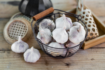 garlic bulbs on vintage wooden background