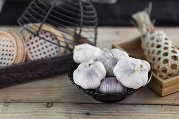 garlic bulbs on vintage wooden background