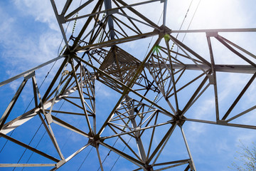 Upward view of the structure under power transmission tower agai