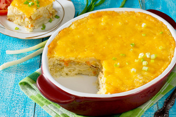 Baked potatoes with cream, cheese and fish fillets