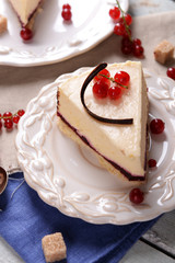 Tasty cheesecake with berries on table close up