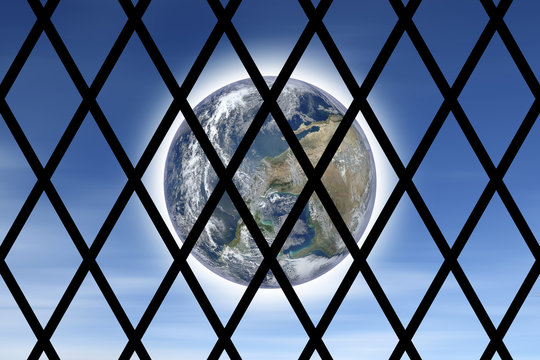 Conceptual image of the world seen through a prison bars - concept with image from NASA