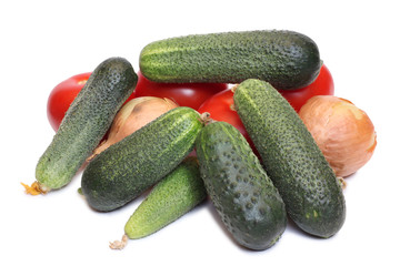 Green cucumber and red tomatos on white background