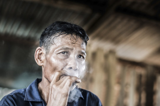 Old man smoking cigarette
