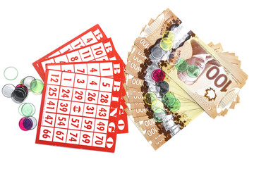 Bingo cards, cash and marker
