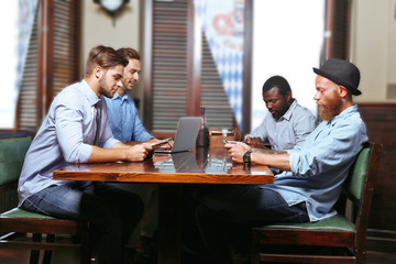 Fototapeta na wymiar Young men talking in cafe