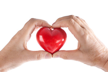 Obraz premium Hände halten rotes Herz