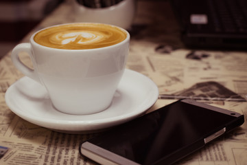 A cup of decorated cappuccino