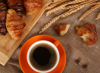Morning cup of coffee and croissant 
