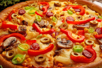 Delicious sliced pizza with vegetables, close-up