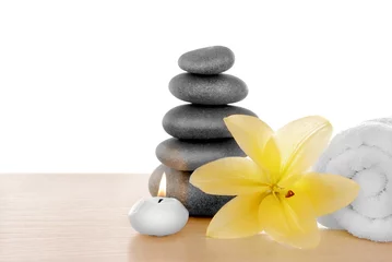 Foto op Canvas Spa stones with candle, towel and lily, isolated on white © Africa Studio